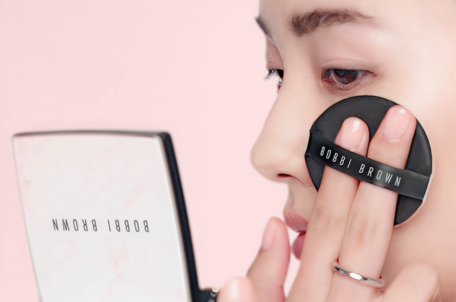 Model removing makeup with our gentle yet powerful Soothing Cleansing Oil