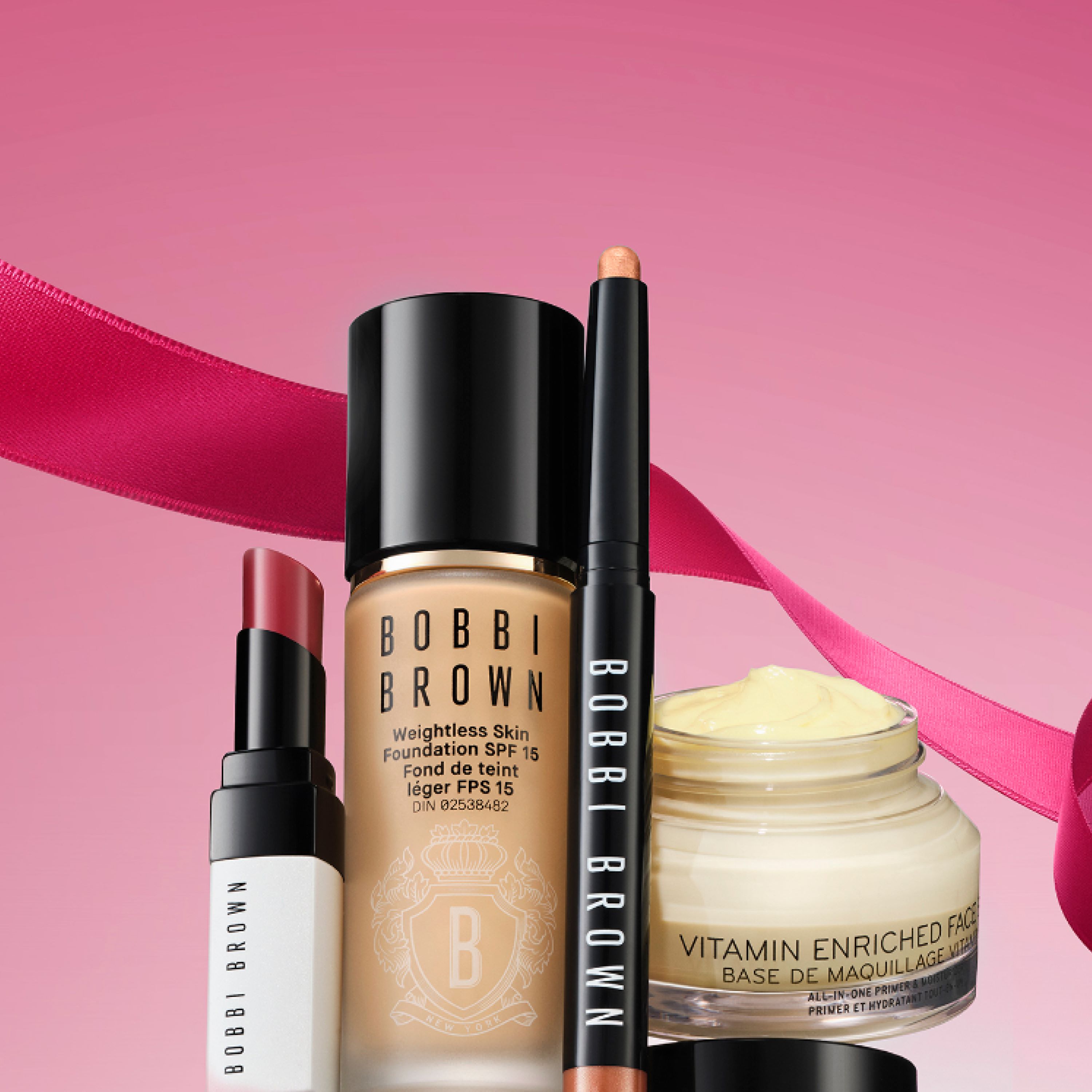 Model applying Skin Long-Wear Weightless Foundation to skin with a foundation brush