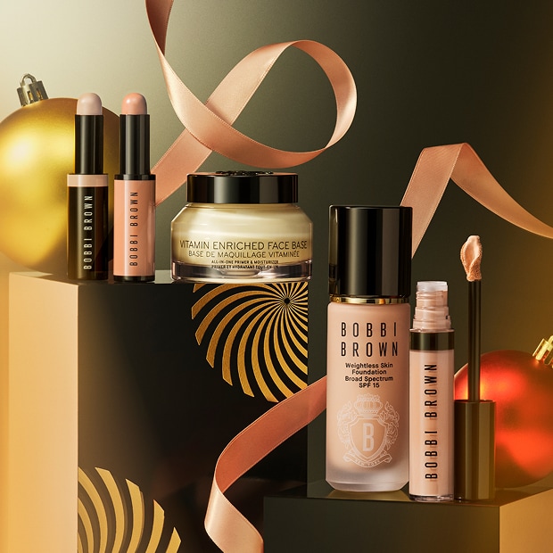 Close up of model eye showcasing defined brows and a natural, shimmery eye look